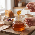 beehive-style glass honey jar with lid and dipper spoon